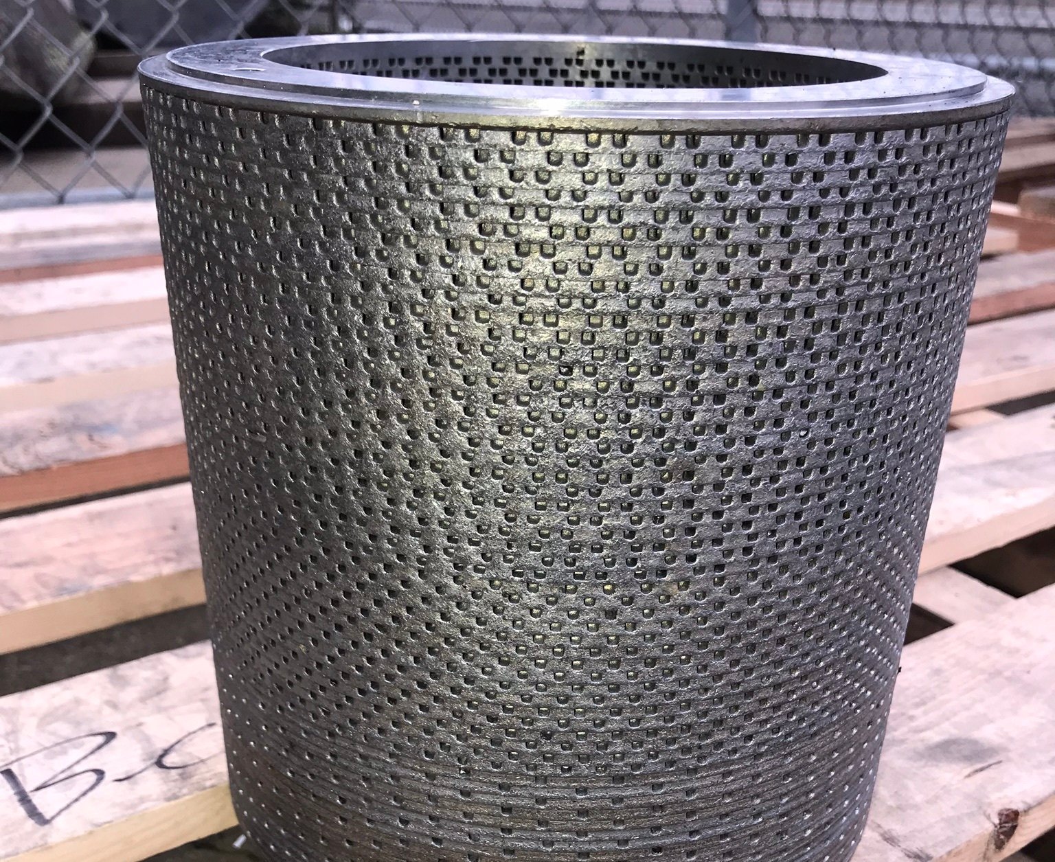 Rusty industrial stainless steel filter before professional cleaning.
